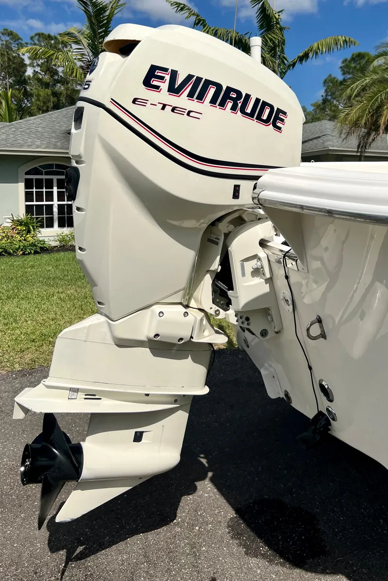 Slide: The Image of 2010 Carolina Skiff 198 DLV Elite with Evinrude E-TEC outboard motor. - 26