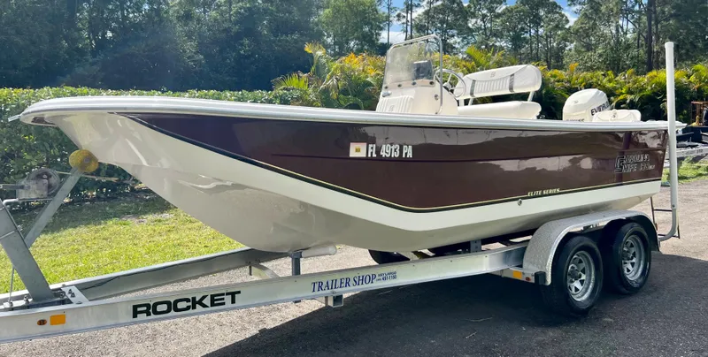 Slide: The Image of 2010 Carolina Skiff 198 DLV Elite boat on a Rocket trailer. - 5