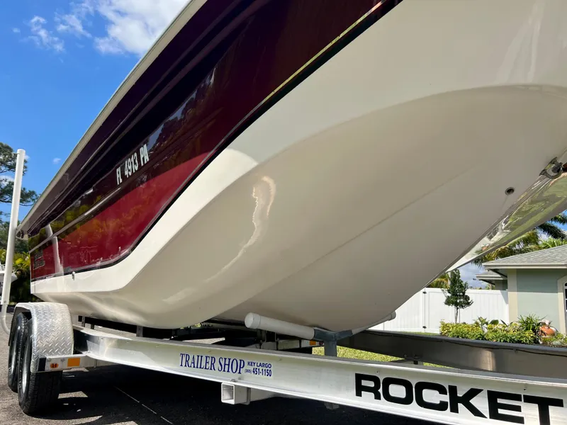 Slide: The Image of 2010 Carolina Skiff 198 DLV Elite boat on a Rocket trailer. - 6