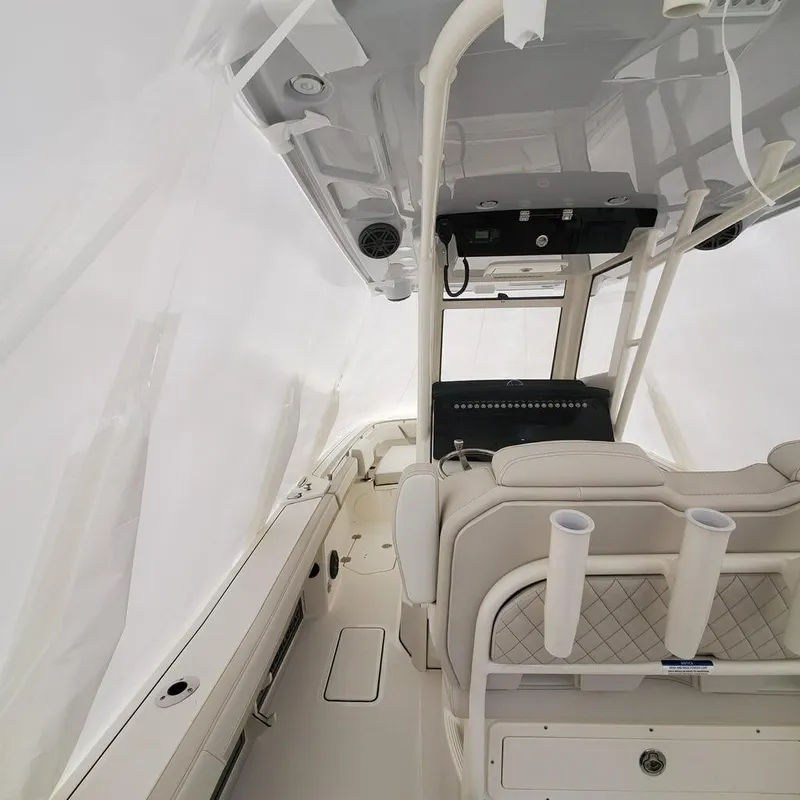 Slide: The Image of Interior of 2023 World Cat 260CC-X boat, featuring helm station and seating. - 5