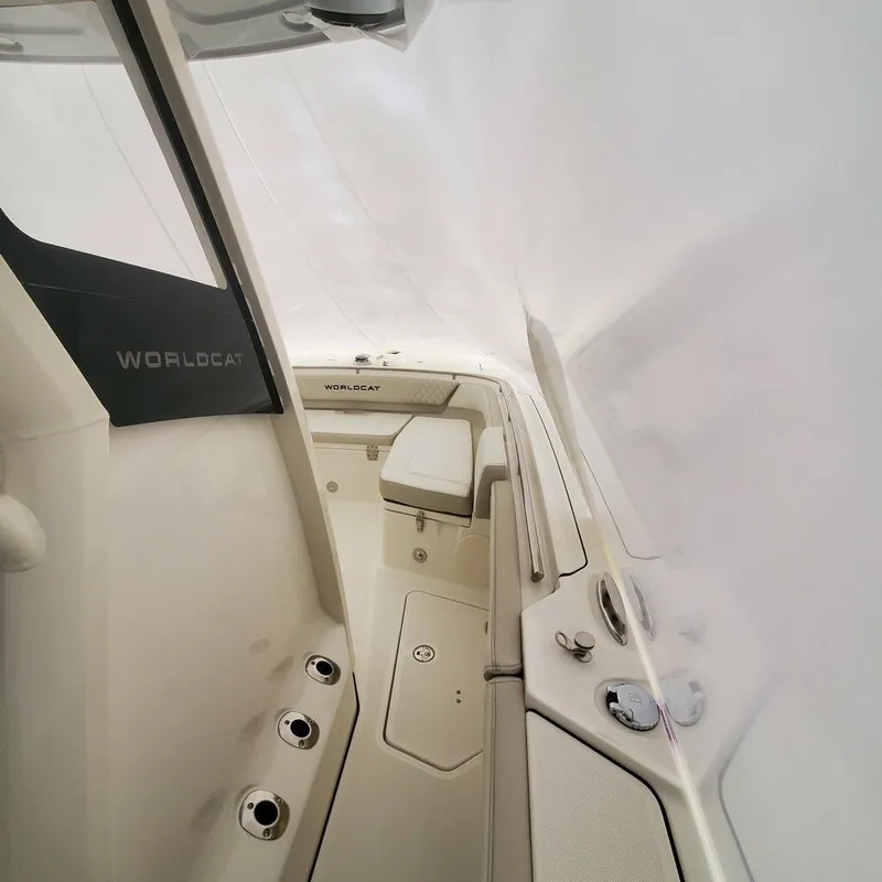 Slide: The Image of 2023 World Cat 260CC-X boat interior with seating and control panel. - 7