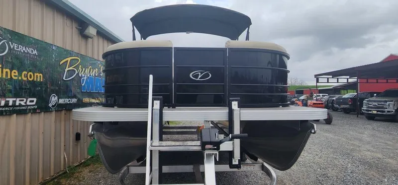 Slide: The Image of 2023 Veranda VISTA20RC Bi-Toon pontoon boat on trailer at dealership. - 2