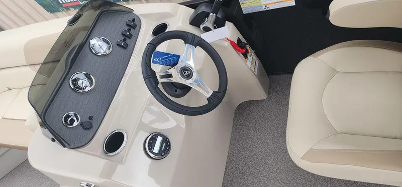 Slide: The Image of 2023 Veranda VISTA20RC Bi-Toon boat dashboard and steering wheel. - 21