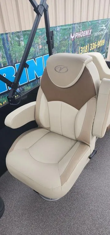 Slide: The Image of 2023 Veranda VISTA20RC Bi-Toon boat seat, beige and brown, with armrests. - 22