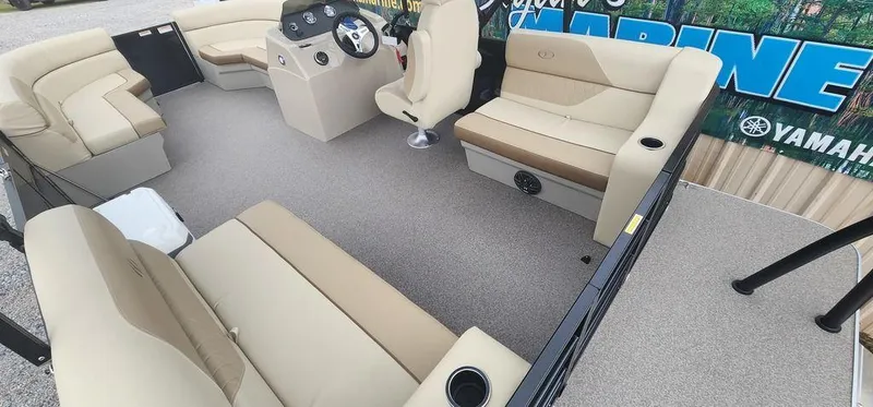 Slide: The Image of 2023 Veranda VISTA20RC Bi-Toon boat interior with beige seating and steering console. - 24