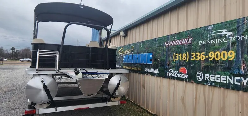 Slide: The Image of 2023 Veranda VISTA20RC Bi-Toon boat displayed outside Bryan's Marine. - 4