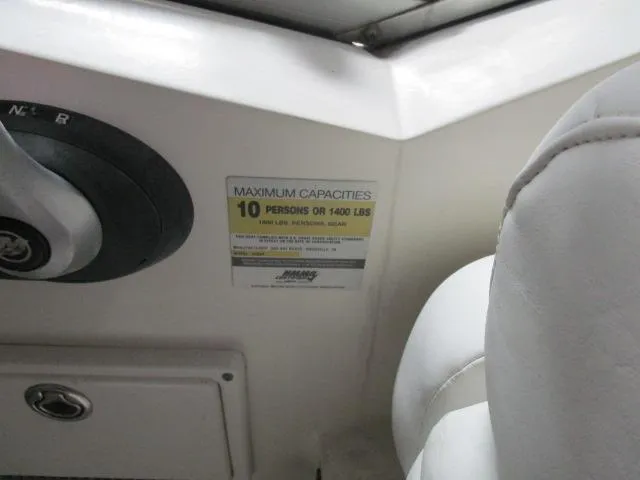 Slide: The Image of Compact bathroom in 2006 Sea Ray 240 Sundancer boat with toilet and sink. - 10