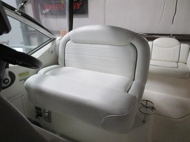 Slide: The Image of Interior of 2006 Sea Ray 240 Sundancer with kitchenette, sink, and microwave. - 11