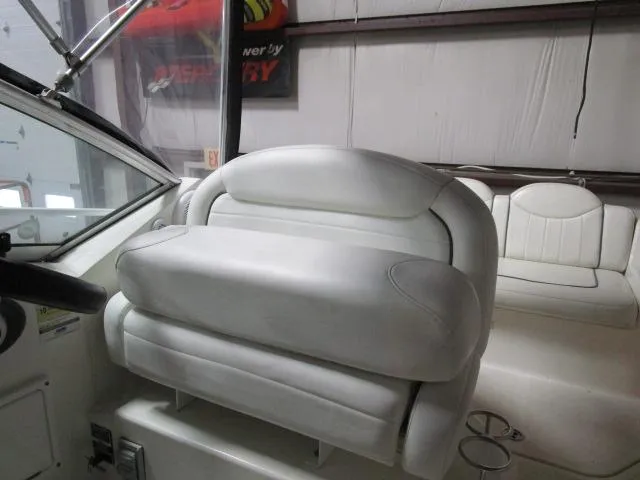 Slide: The Image of Engine compartment of a 2006 Sea Ray 240 Sundancer boat with visible components. - 12