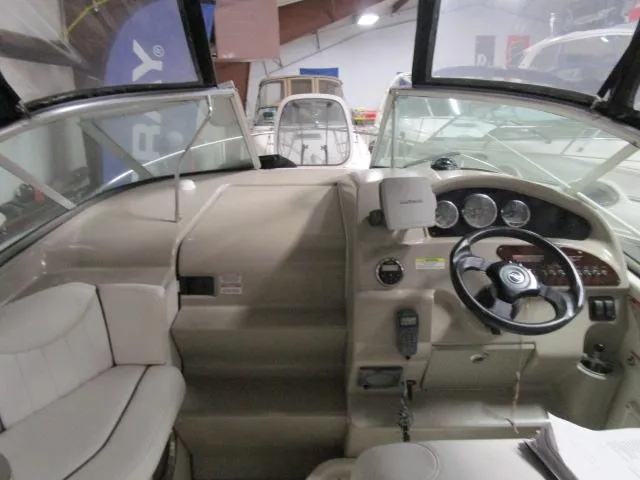 Slide: The Image of Interior of a 2006 Sea Ray 240 Sundancer boat with white seating. - 7