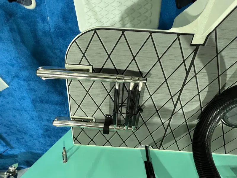 Slide: The Image of 2024 Defiance Admiral 250 EX boat deck with stainless steel ladder. - 12