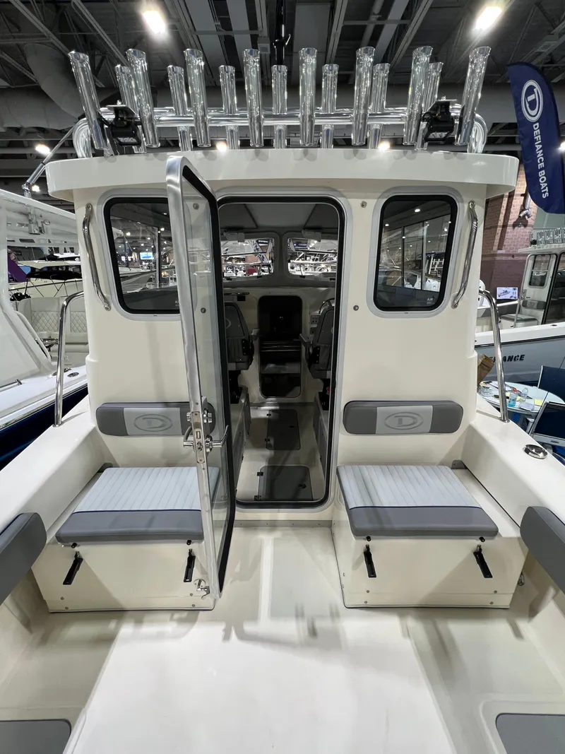 Slide: The Image of 2024 Defiance Admiral 250 EX boat interior with seating and rod holders. - 14