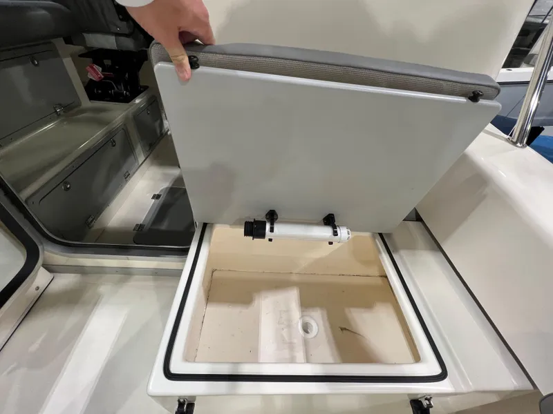Slide: The Image of 2024 Defiance Admiral 250 EX boat storage compartment being opened. - 15