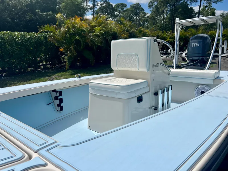 Slide: The Image of 2011 Maverick 18 HPX-V boat interior with seating and console. - 13