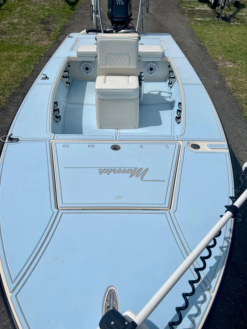 Slide: The Image of 2011 Maverick 18 HPX-V boat with light blue deck and seating. - 14