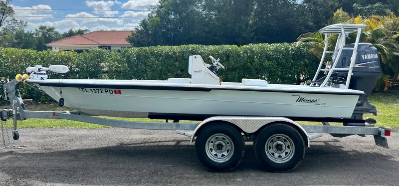 Slide: The Image of 2011 Maverick 18 HPX-V boat on a trailer with Yamaha outboard motor. - 2