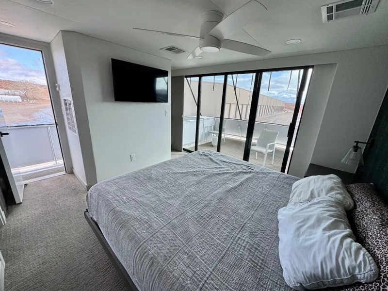 Slide: The Image of Modern bedroom in Adonia Solace Trip #10, 2021, with large windows and balcony view. - 15