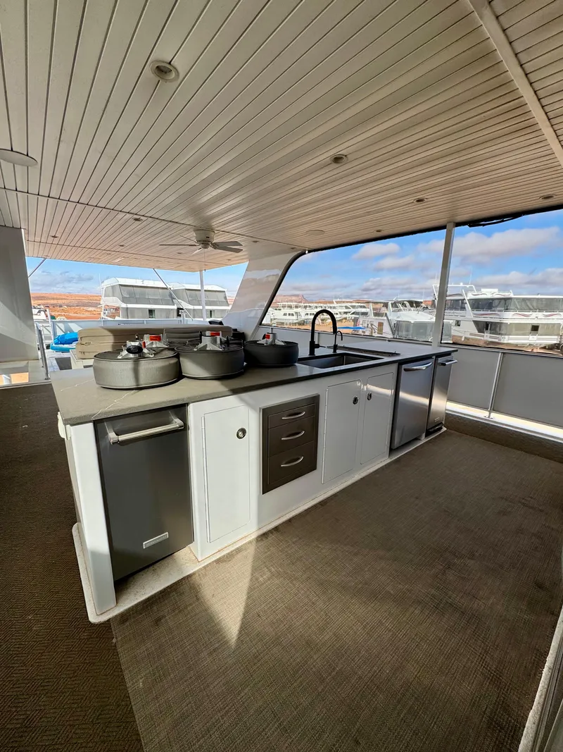 Slide: The Image of Outdoor kitchen on 2021 Adonia Solace Trip #10 houseboat with modern appliances. - 22