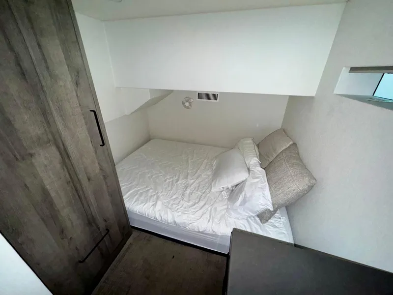 Slide: The Image of Compact bedroom in Adonia Solace Trip #10, 2021 model, featuring a cozy bed and modern design. - 4