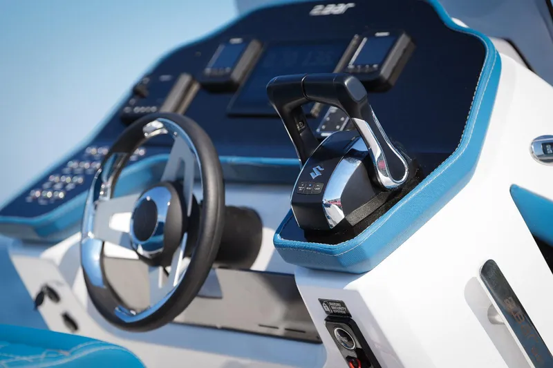 Slide: The Image of 2025 2 Bar 8.2 boat dashboard with steering wheel and throttle controls - 14