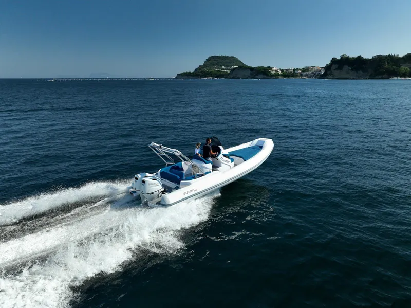 Slide: The Image of 2025 2 Bar 8.2 boat cruising on open water near scenic coastline - 15