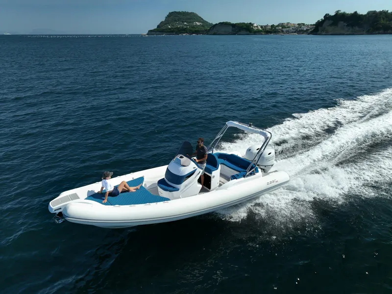 Slide: The Image of 2025 2 Bar 8.2 boat cruising on open water with passengers. - 18