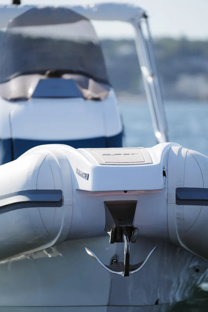 Slide: The Image of 2025 2 Bar 8.2 inflatable boat on water, rear view. - 19