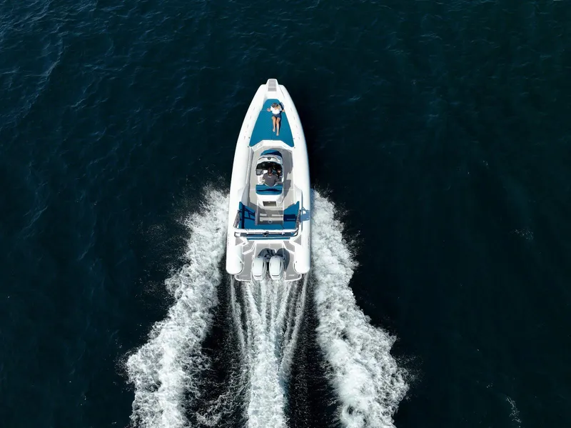 Slide: The Image of Aerial view of 2025 2 Bar 8.2 boat cruising on open water. - 21