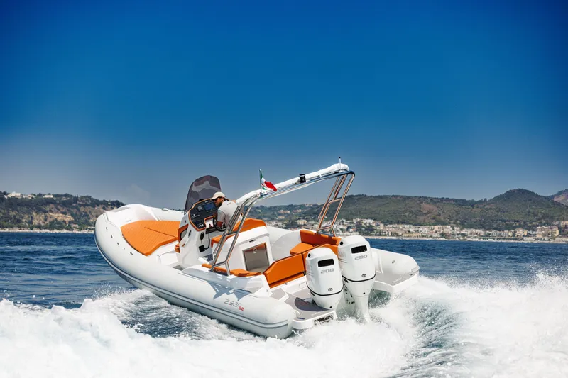 Slide: The Image of 2025 2 Bar 8.2 boat speeding on water with twin engines. - 22