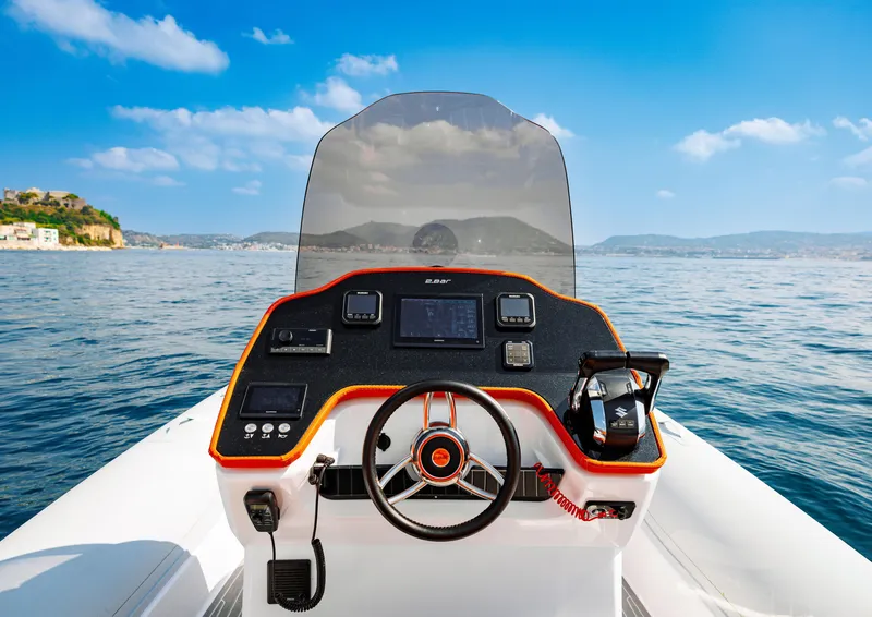 Slide: The Image of 2025 2 Bar 8.2 boat dashboard with ocean view and clear blue sky. - 25