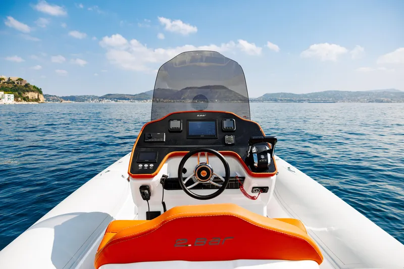 Slide: The Image of 2025 2 Bar 8.2 boat dashboard with scenic ocean view. - 27