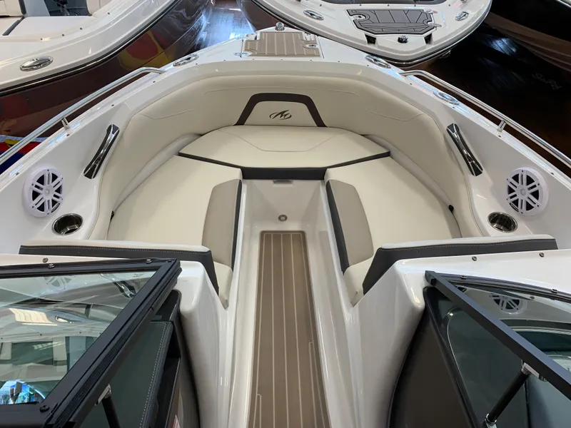 Slide: The Image of 2023 Monterey 224FS boat interior with cushioned seating and modern design. - 3