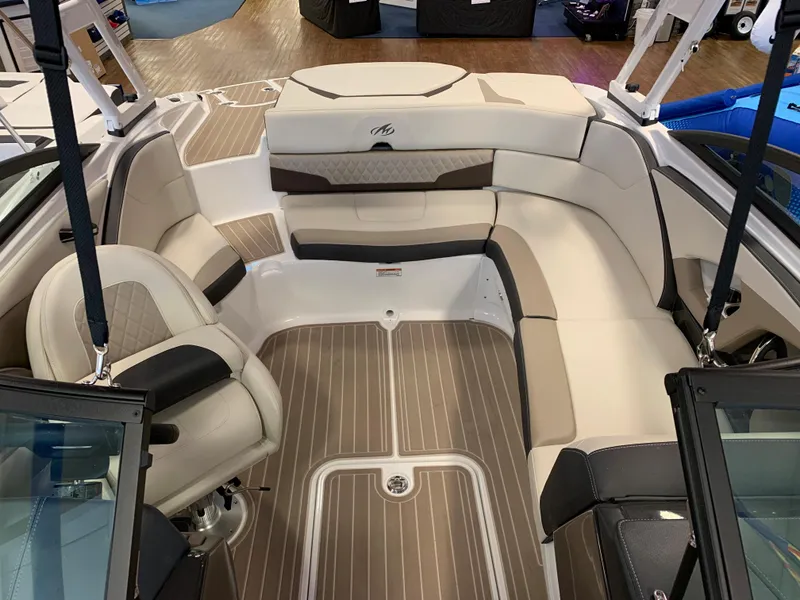 Slide: The Image of 2023 Monterey 224FS boat interior with beige and brown seating. - 4