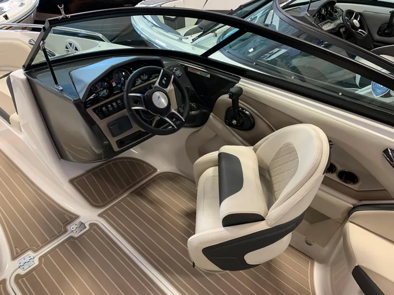 Slide: The Image of 2023 Monterey 224FS boat interior with steering wheel and captain's chair. - 5