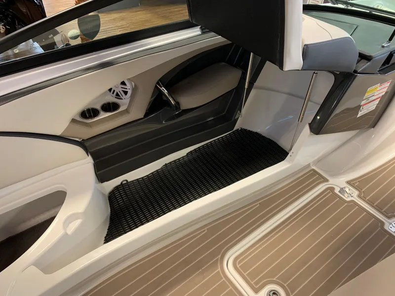 Slide: The Image of 2023 Monterey 224FS boat interior with seating and flooring details. - 8