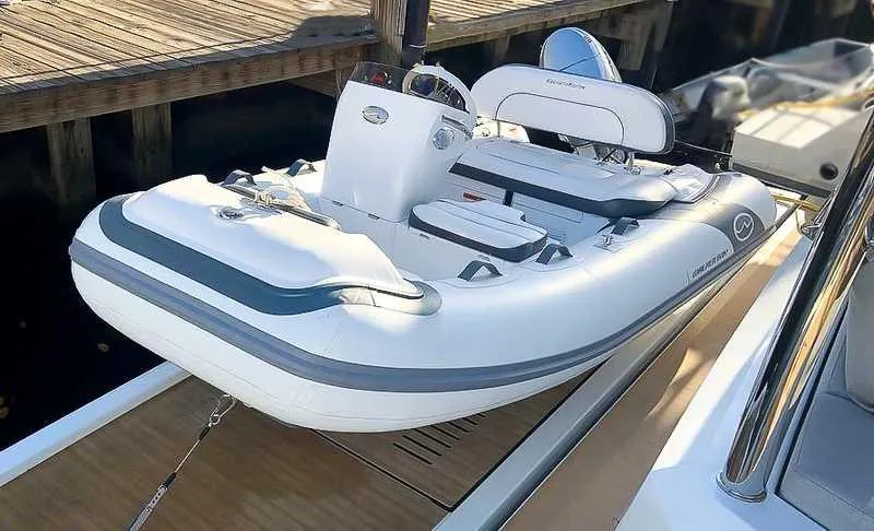 Slide: The Image of 2025 Walker Bay Generation 10 LTE inflatable boat docked. - 10