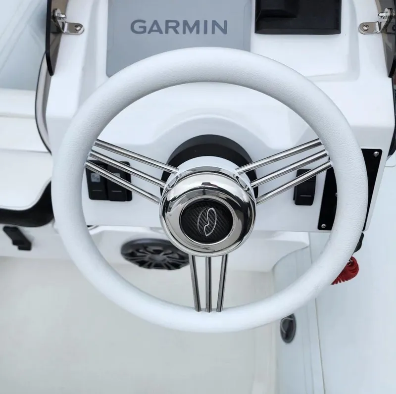Slide: The Image of Steering wheel of 2025 Walker Bay Generation 10 LTE boat with Garmin navigation system. - 3