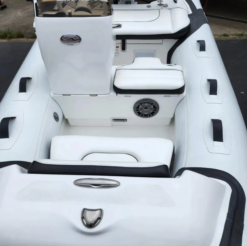 Slide: The Image of 2025 Walker Bay Generation 10 LTE inflatable boat interior with white seating and black accents. - 5