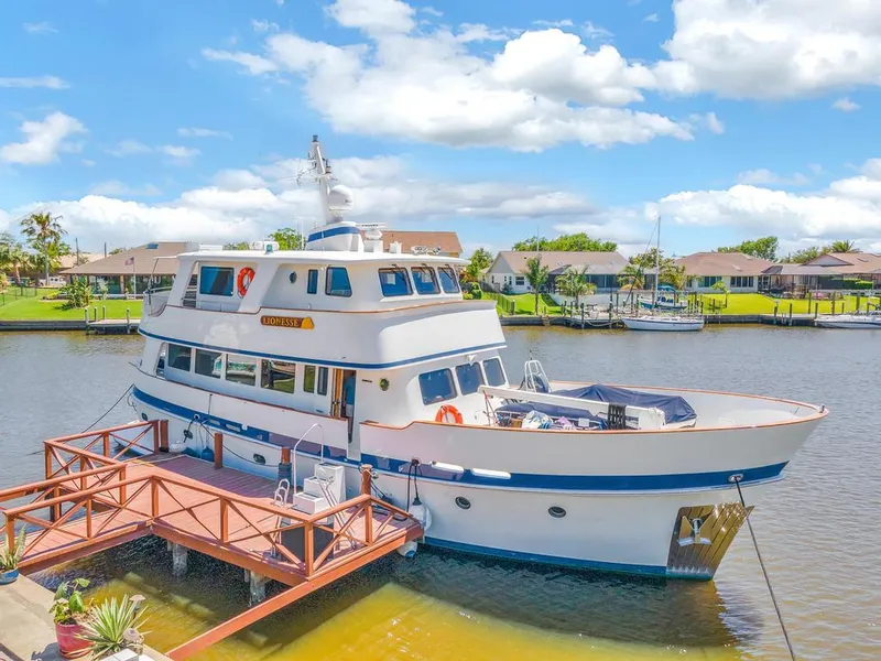 The Image of Cheoy Lee Expedition 70 yacht docked by waterfront homes, 2001 model. - 0