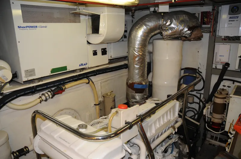 Slide: The Image of Engine room of 2001 Cheoy Lee Expedition 70 yacht, featuring machinery and equipment. - 22