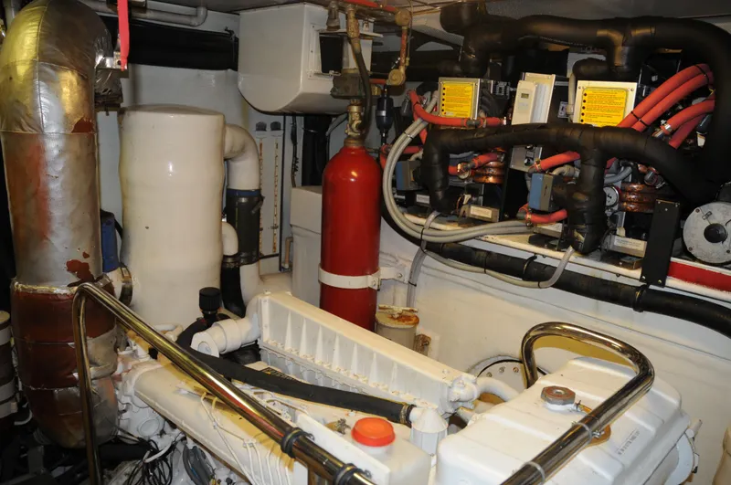 Slide: The Image of Engine room of 2001 Cheoy Lee Expedition 70 yacht, featuring machinery and equipment. - 23