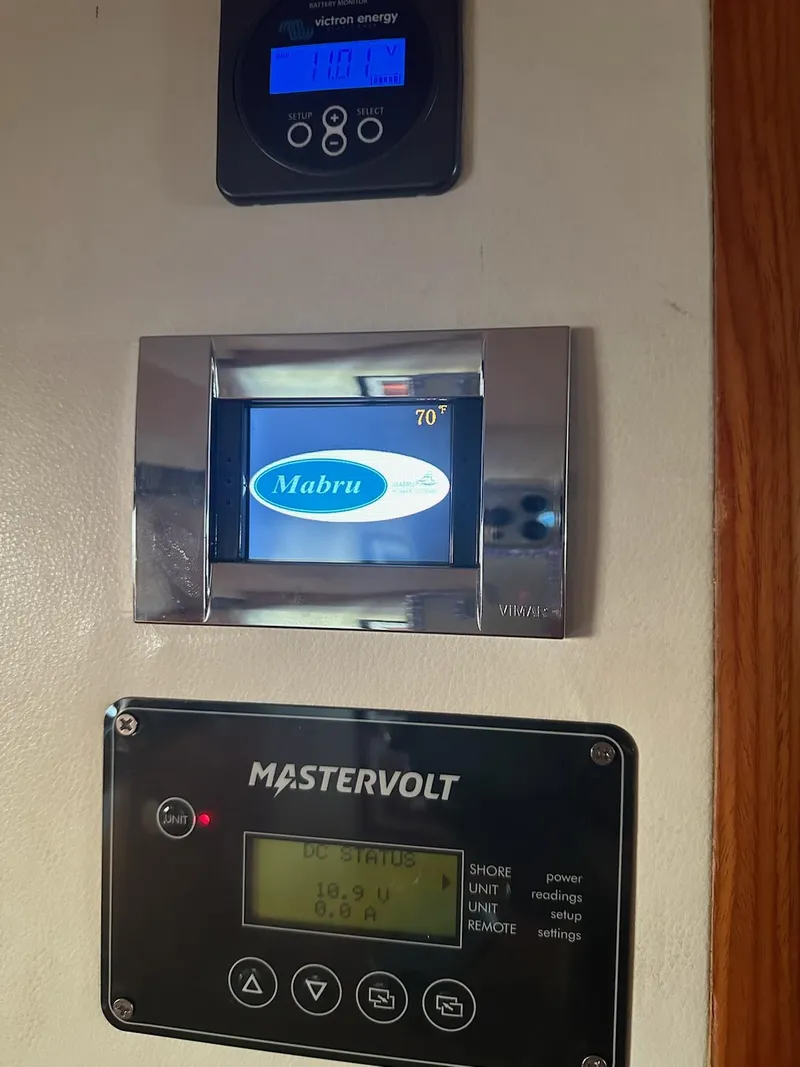 Slide: The Image of Control panels on a 2001 Cheoy Lee Expedition 70 yacht, featuring Mabru and Mastervolt systems. - 26