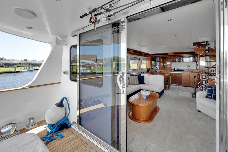 Slide: The Image of Luxurious interior of 2001 Cheoy Lee Expedition 70 yacht with elegant seating and wooden accents. - 36