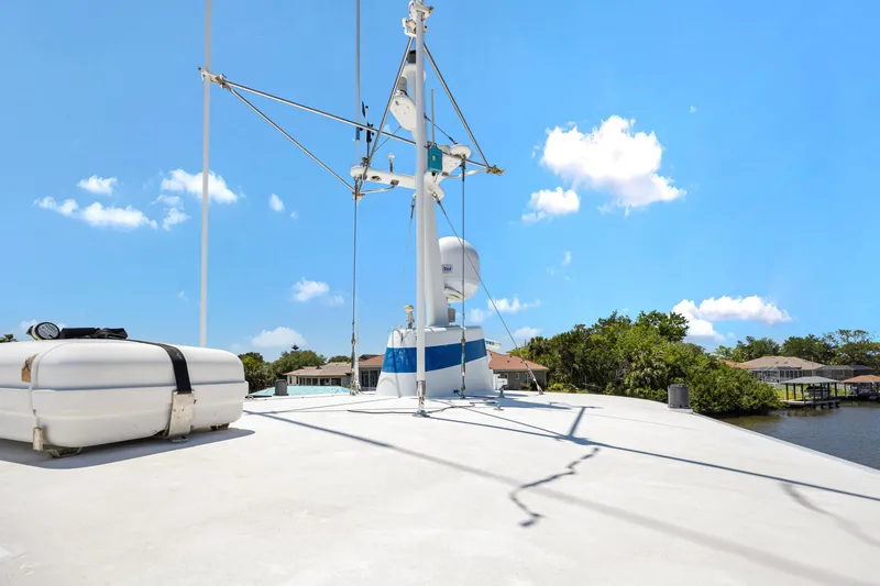 Slide: The Image of Cheoy Lee Expedition 70 yacht deck, 2001 model, under clear blue sky. - 43