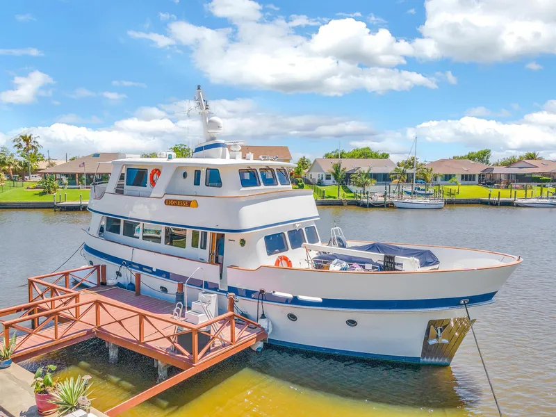 Slide: The Image of Cheoy Lee Expedition 70 yacht docked by waterfront homes, 2001 model. - 45