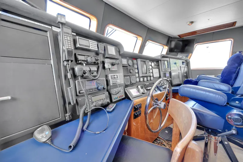 Slide: The Image of Pilothouse of 2001 Cheoy Lee Expedition 70 yacht with navigation equipment and steering wheel. - 6