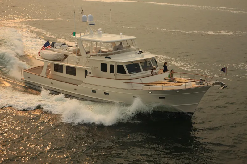 The Image of Luxurious 2026 Fleming 65 Pilothouse yacht cruising on open water. - 0