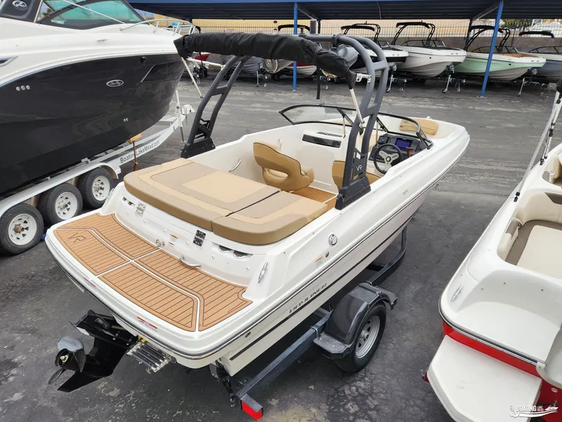 Slide: The Image of 2023 Bayliner VR4 boat on trailer, featuring sleek design and spacious seating. - 6