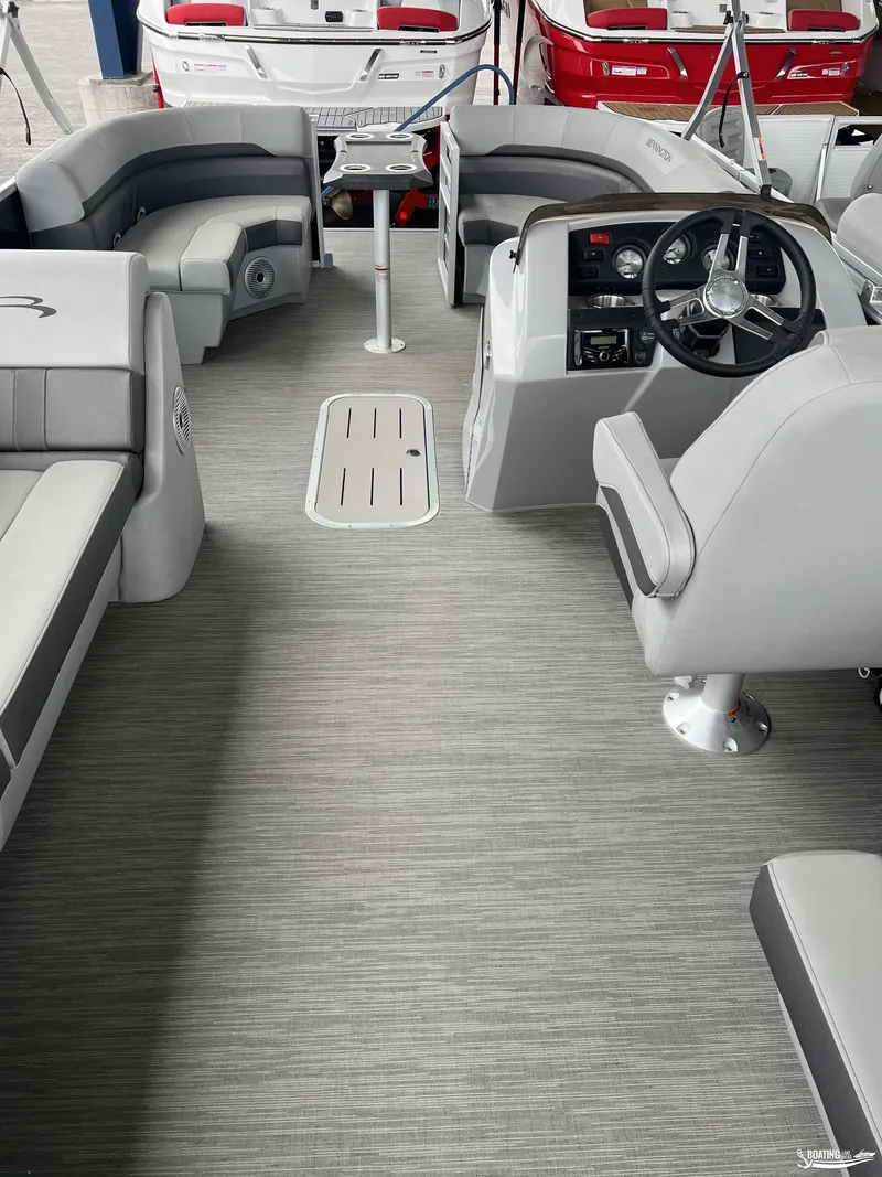 Slide: The Image of 2023 Bennington 21SXSRC pontoon boat interior with gray seating and steering console. - 5
