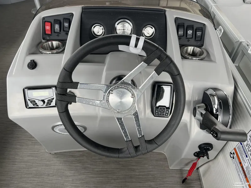 Slide: The Image of 2023 Bennington 21SF boat dashboard with steering wheel and controls. - 7